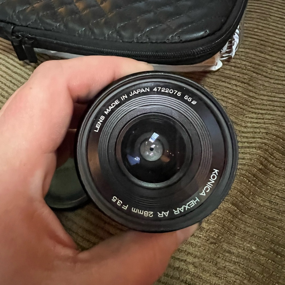 Vintage still working KONICA camera lens and casing 28mm f3.5